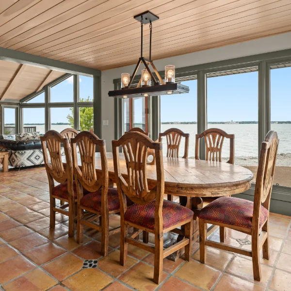 Waterfront dining room inside Limestone Bay's private lodge accommodations